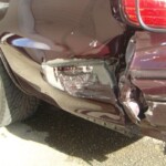 Before and after photographs of a damaged Chevy Impala that was repaired by Elite Paint & Body Shop in West Palm Beach, Florida.